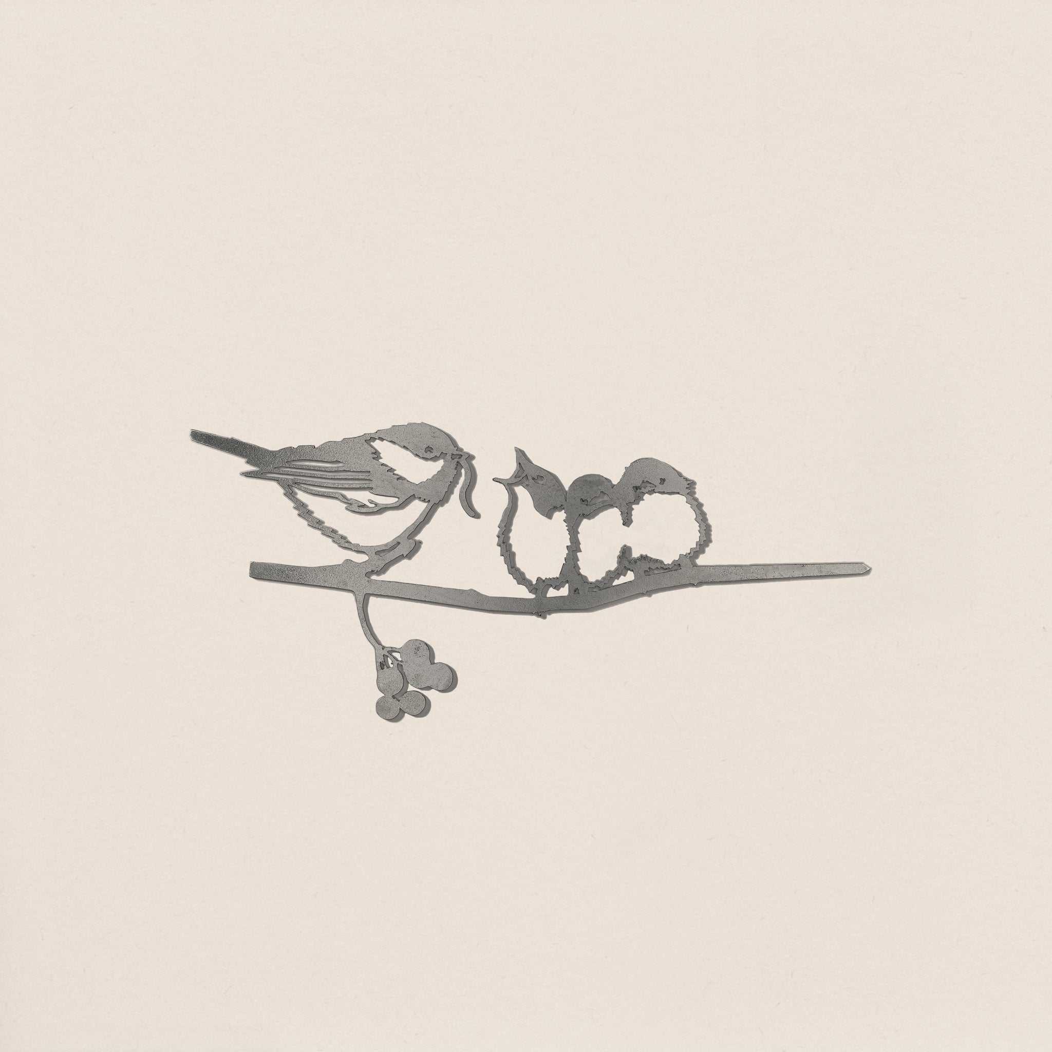 The "Chickadee & Chicks" by Metalbird Canada features a minimalist bird feeding two chicks on a branch with berries, crafted in sleek monochrome lines—a unique and elegant gift for any garden lover.