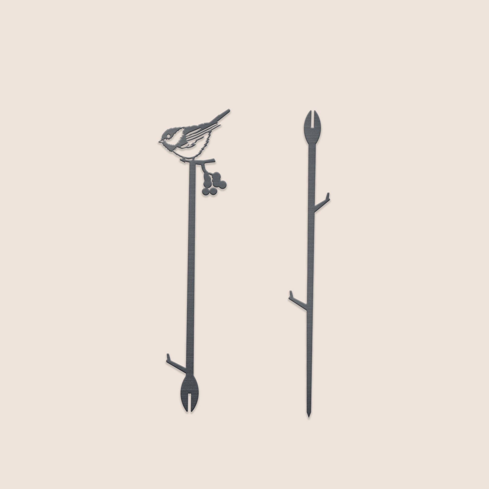 The Chickadee Plant Stake - 25" by Metalbird Canada features a striking black metal silhouette of a bird with berries, adding distinctive garden art to any space. Displayed on a plain, light background, it's the perfect accent for your outdoor decor.