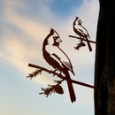 The Cardinal Mom & Mini Set by Metalbird Canada features two cardinal silhouettes on branches, set against a dreamy sky—an ideal gift for bird lovers.