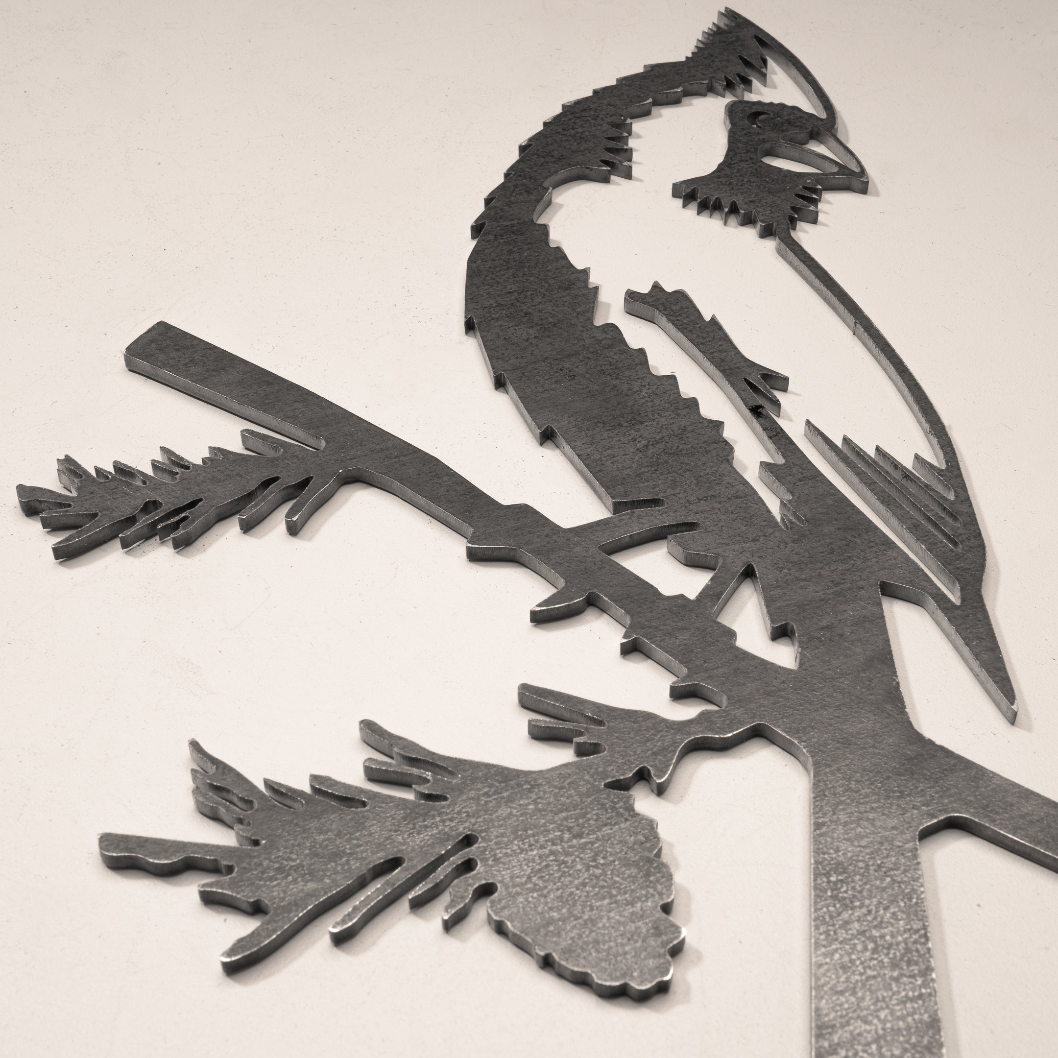 The Cardinal Mom & Mini Set by Metalbird Canada features metal cardinal silhouettes perched on pine branches—a stylish addition to any decor and a thoughtful gift for bird lovers. Displayed against a plain light background.