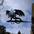 The BALROG™ by Metalbird Canada is a striking metal dragon silhouette with wings and flames, mounted on a post—an eye-catching piece of garden art for any outdoor setting.