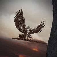 A striking Metalbird Canada GANDALF™ ON GWAIHIR™ silhouette features Gandalf atop Gwaihir, wings spread wide, perched on a branch. This unique yard art adds magical charm and elegance to any outdoor space.