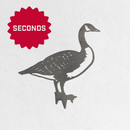 Metalbird Seconds by Metalbird Canada - Seconds: a corten steel goose silhouette set against a white textured background, featuring a red starburst label in the top left with "SECONDS" in bold white letters.