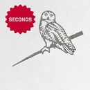 A black and white illustration of an owl perched on a branch appears on a white background with a red "SECONDS" starburst—ideal inspiration for striking Metalbird Seconds by Metalbird Canada - Seconds yard art or metal designs.