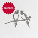 The Metalbird Canada - Seconds "Metalbird Seconds" features two birds on a branch, crafted from corten steel and displayed on a white textured wall with a red SECONDS starburst in the corner.