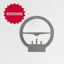 The Metalbird Seconds by Metalbird Canada - Seconds features a round corten steel wall clock frame with a red starburst icon labeled SECONDS on the upper left and a METAL BIRD cutout at the bottom, making it a unique modern gift.