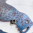 Close-up of Metalbird Canada - Seconds' Metalbird Seconds: a rusty, weathered corten steel cat-shaped wall decoration mounted on a white textured wall—an eye-catching garden art piece.