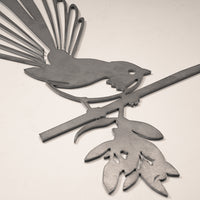 The Fantail / New Zealand Pīwakawaka by Metalbird Canada is a stunning metal silhouette of a bird on a leafy branch—ideal as unique garden art or a thoughtful gift.