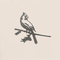 The Cardinal by Metalbird Canada features a sleek black and white silhouette with its crest, perched on a leafy branch against a light background—ideal as a unique gift or standout piece of yard art.