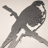 The Peregrine Falcon by Metalbird Canada is a detailed metal cutout sculpture of a falcon on a branch, adding striking garden art and making a unique gift for nature lovers.