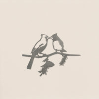 Kissing Cardinals by Metalbird Canada features a minimalist design of two cardinals perched together on a leafy branch, set against a light background—ideal inspiration for corten steel yard art.