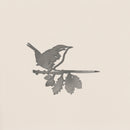 The Wren by Metalbird Canada is a corten steel silhouette of a small bird on a leafy branch, set against a light beige backdrop—ideal as charming yard art.