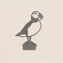 The Puffin by Metalbird Canada is a metal silhouette of a puffin standing on a rock, perfect as unique garden art or a thoughtful gift for nature lovers.