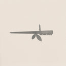 A minimalist illustration of Metalbird Canada’s Stick Bird Feeder, featuring a Swiss Army knife with leaves replacing tools on a light background—perfect as yard art or a unique gift for design lovers.