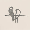 The Pair of Swallows by Metalbird Canada features two minimalist swallows perched closely together, crafted in striking grayscale metal silhouette—a modern garden art piece set against a clean, light backdrop.