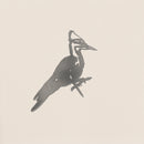 The Pileated Woodpecker by Metalbird Canada features a grayscale, minimalist design highlighting the bird’s crest and long beak—ideal inspiration for corten steel yard art against a simple light background.