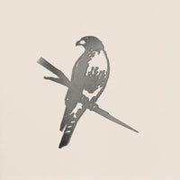 The Red-Tailed Hawk by Metalbird Canada is a corten steel silhouette of a hawk with folded wings, perfect for eye-catching yard art or as a unique gift, shown here against a light background.