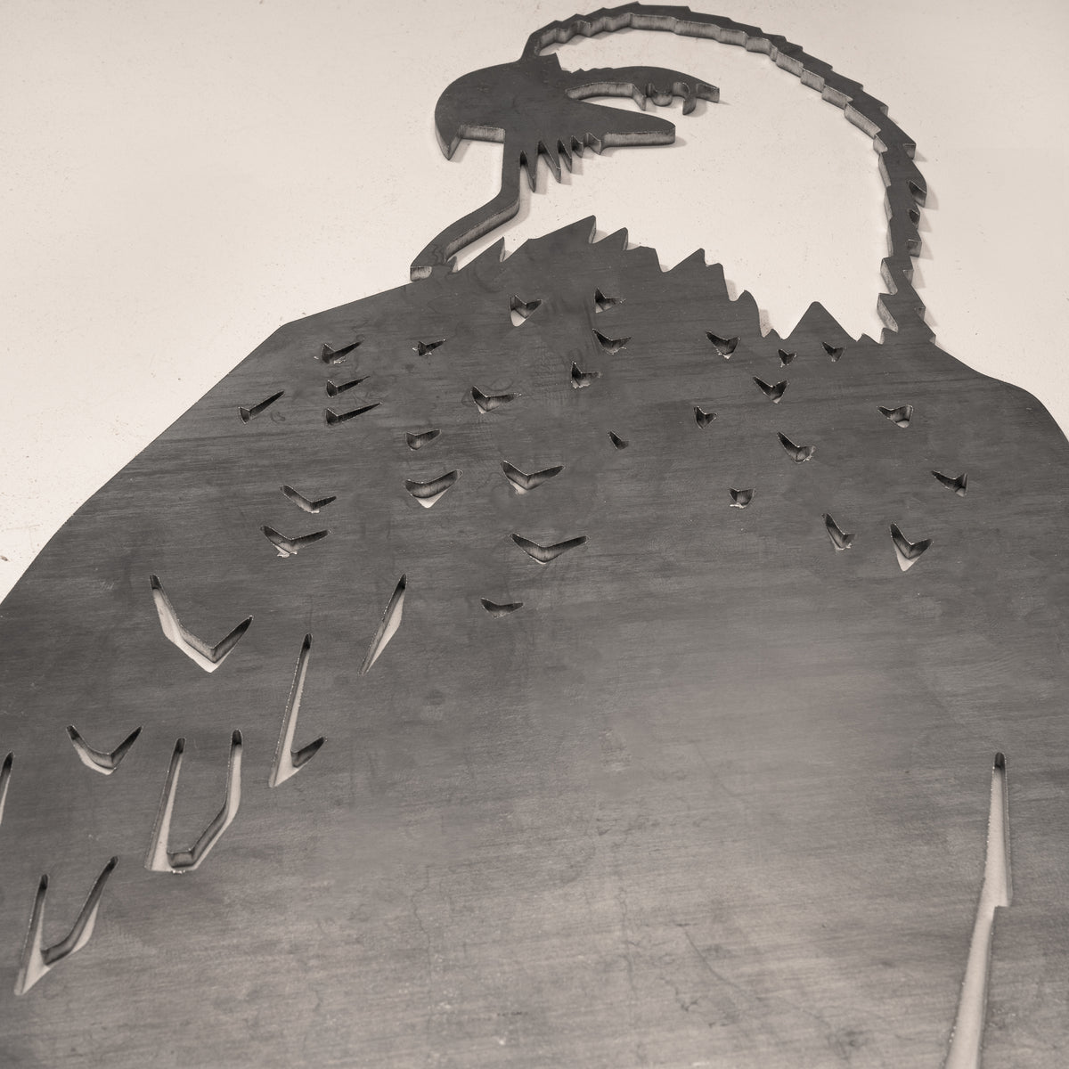 Close-up of the Bald Eagle cut-steel silhouette and surface detail.