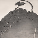 A large metal cutout of a Bald Eagle from Metalbird Canada, viewed from below, displays detailed head and feathers against a plain background—ideal as unique garden art or eye-catching yard decor.