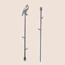 The Metalbird Canada Cardinal Plant Stake - 40" is a black corten steel garden stake featuring a cardinal cutout atop a branch and pointed end for easy placement—an ideal, unique garden gift.