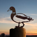 The DU Mallard Duck - Large by Metalbird Canada features a striking metal duck silhouette perched atop a wooden post against a vibrant sunset sky—ideal garden art or a thoughtful, unique gift.